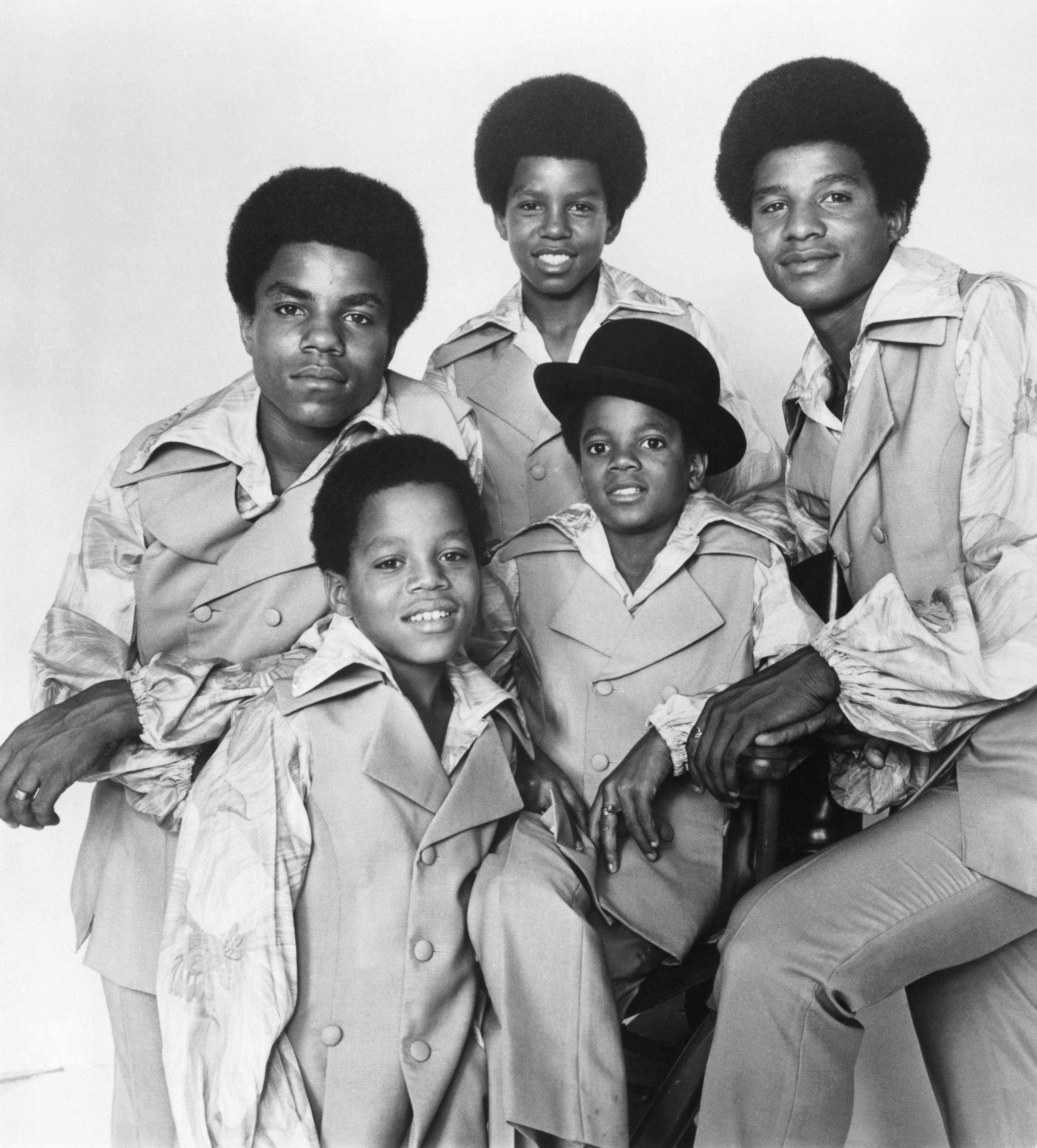 The Jackson Five: Marlon, Tito, Jermaine, Jackie, and Michael Jackson (seated, with hat) posing for a portrait in 1970 in Los Angeles, California. | Source: Getty Images