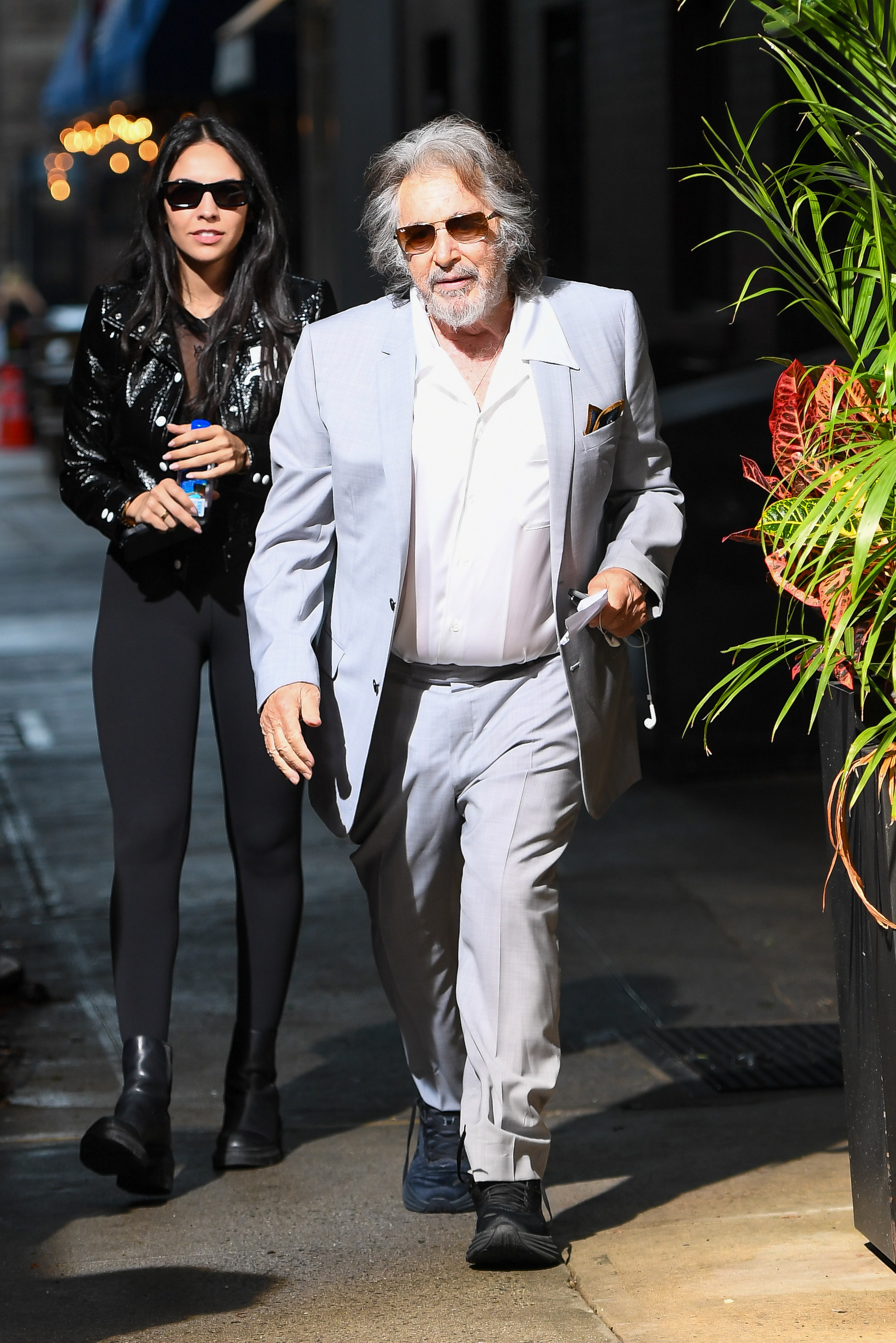 Noor Alfallah and Al Pacino seen on a film shoot on August 24, 2023, in n Manhattan, New York City | Source: Getty Images