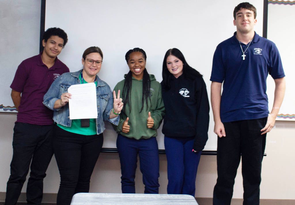 Anna Kepner with fellow students, from a post dated November 11, 2025 | Source: Facebook/TCSLions