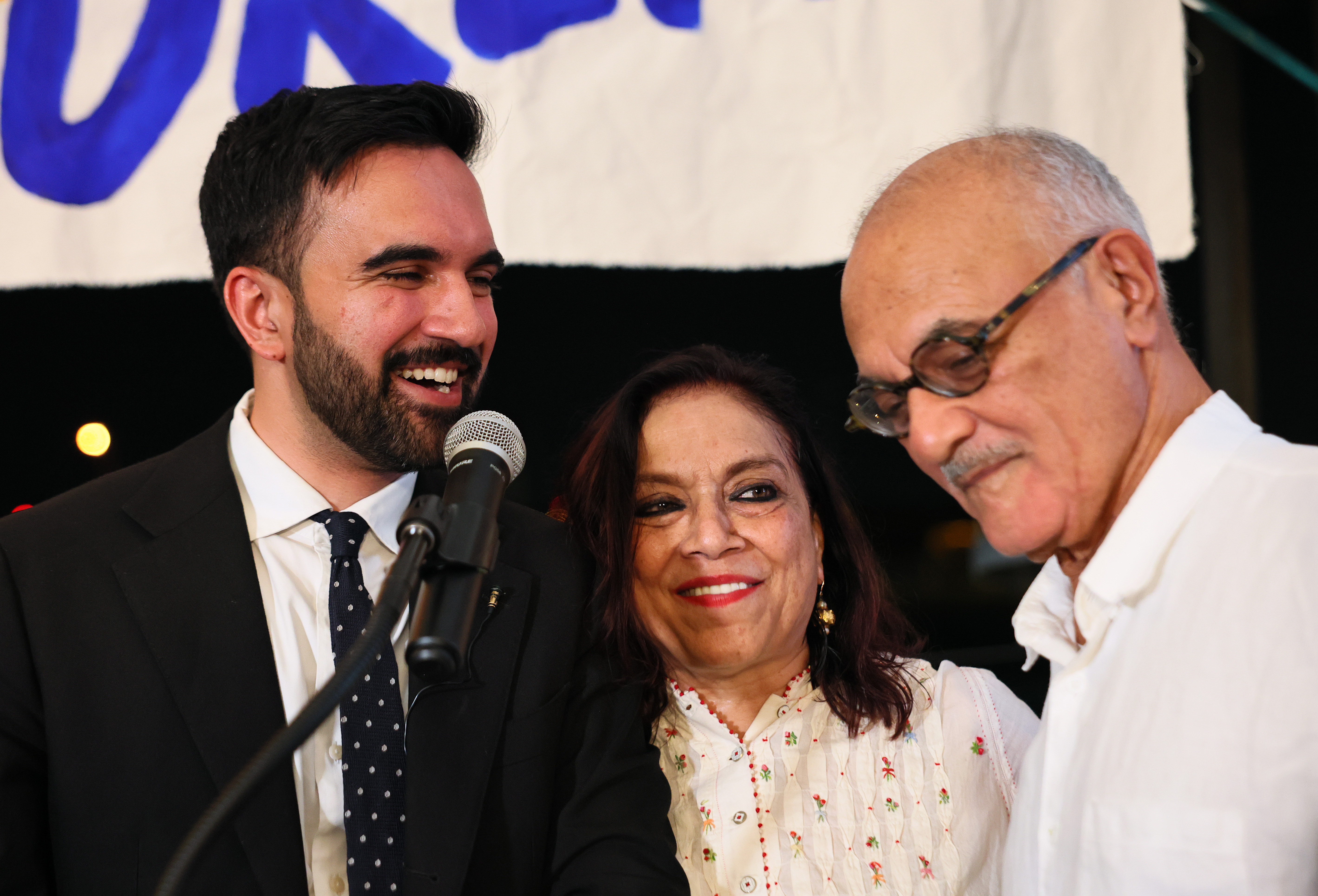 Zohran Mamdani, Mira Nair, and Mahmood Mamdani celebrate during an election night gathering at The Greats of Craft LIC on June 24, 2025, in the Long Island City neighborhood of the Queens borough in New York City | Source: Getty Images