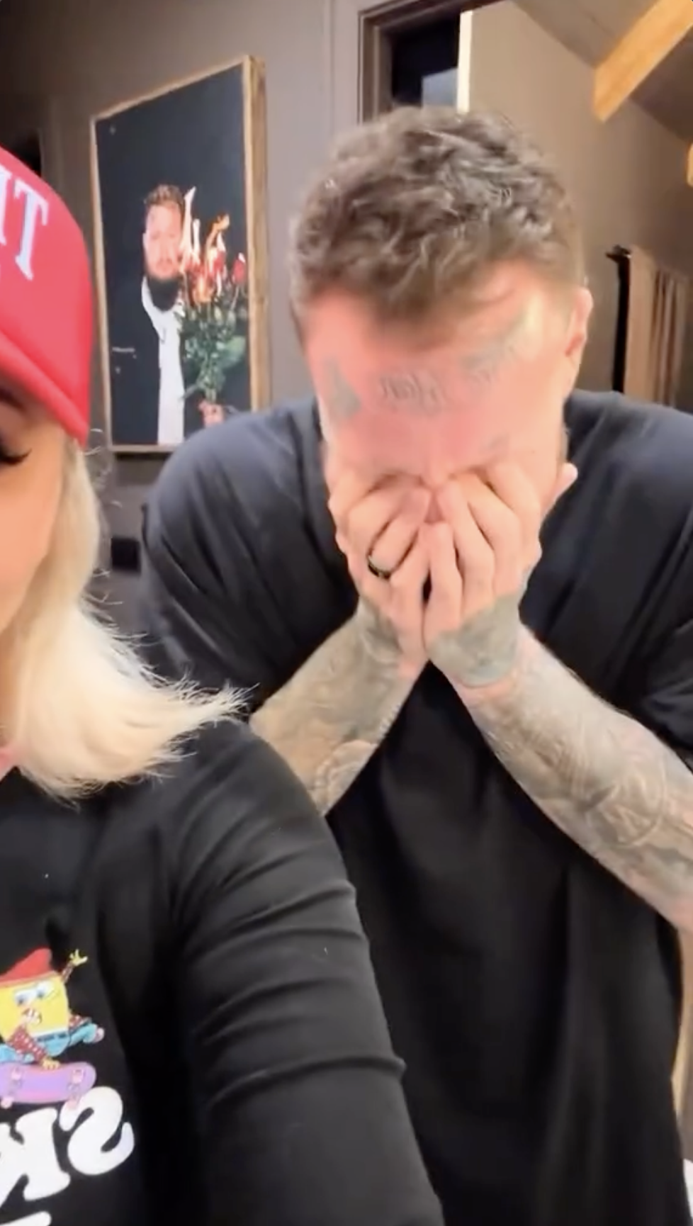 Jelly Roll covers his face as his wife films him before he shaves his beard for the first time, in an Instagram video posted on November 14, 2025.