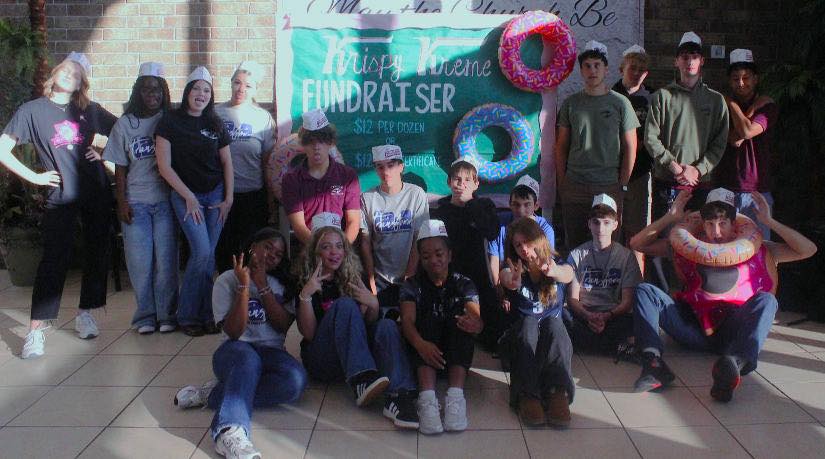 Anna Kepner with fellow students, from a post dated November 11, 2025 | Source: Facebook/TCSLions