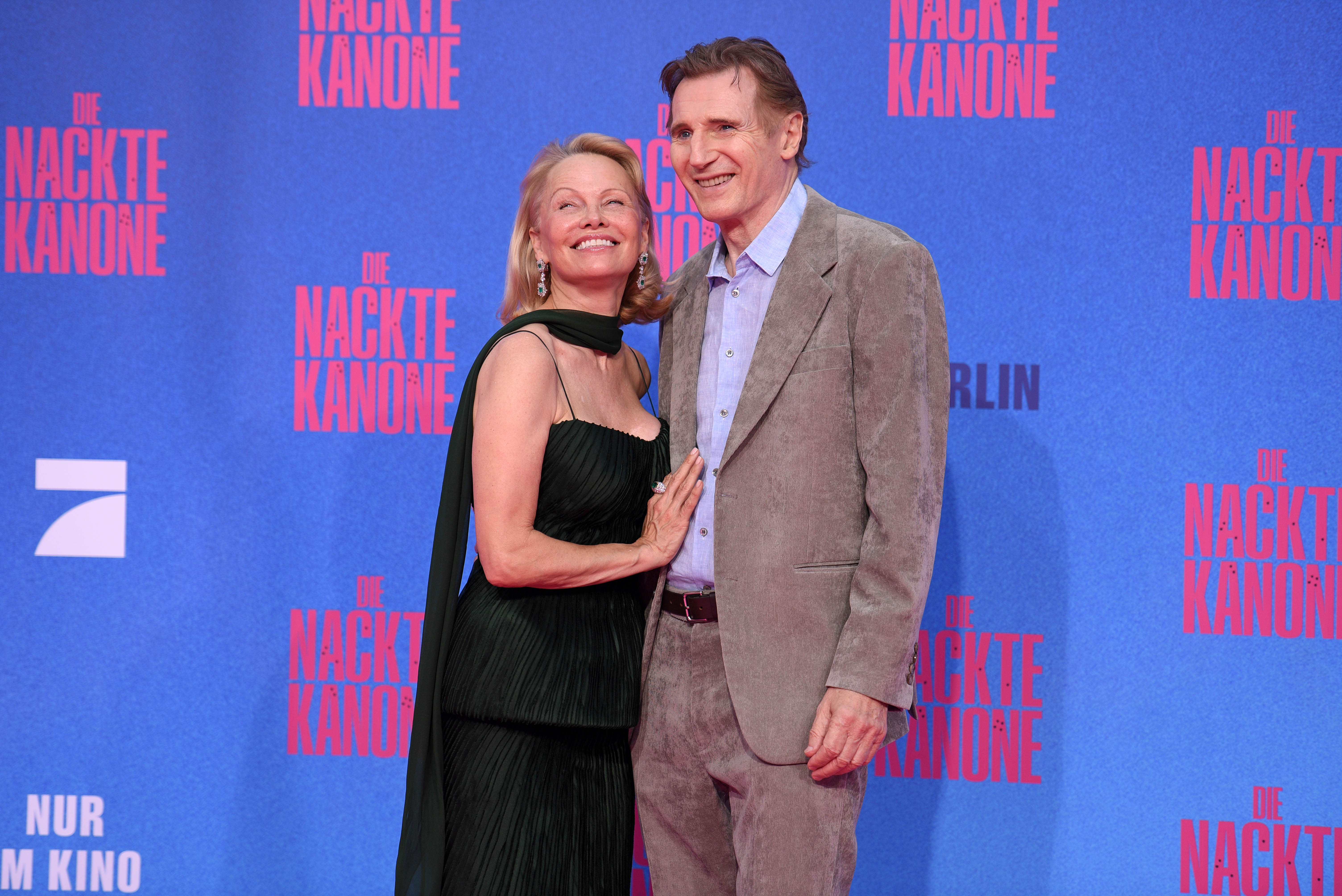 Pamela Anderson and Liam Neeson attend the Berlin premiere of the movie "The Naked Gun" at UCI Luxe East Side Gallery on July 24, 2025 in Berlin, Germany. | Source: Getty Images