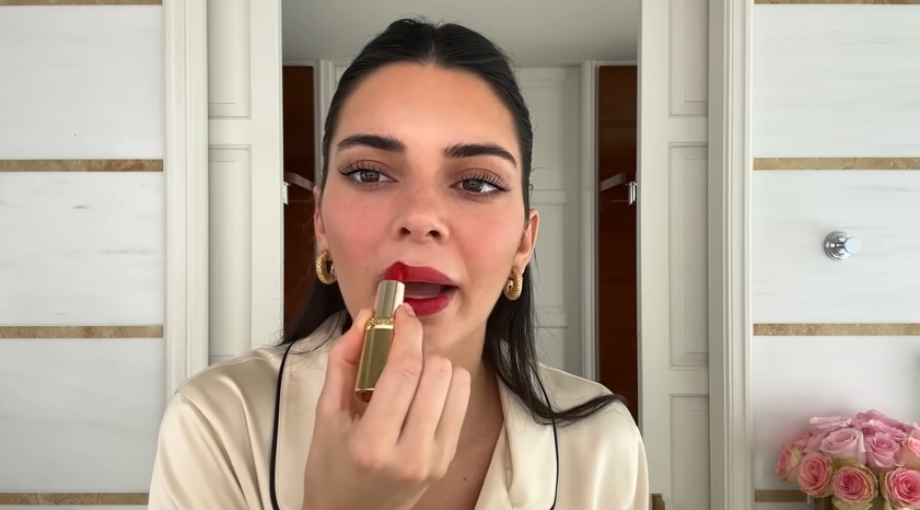 Kendall Jenner doing her Spring French girl makeup routine from a post dated April 11, 2024. | Source: YouTube\Vogue
