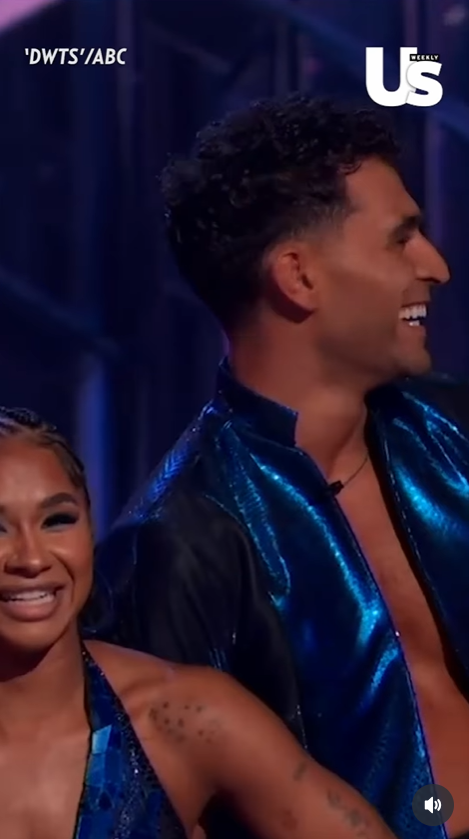 Jordan Chiles and her professional partner Ezra Sosa react to the audience's outburst, as seen from a video post dated November 26, 2025. | Source: Instagram Reel/usweekly