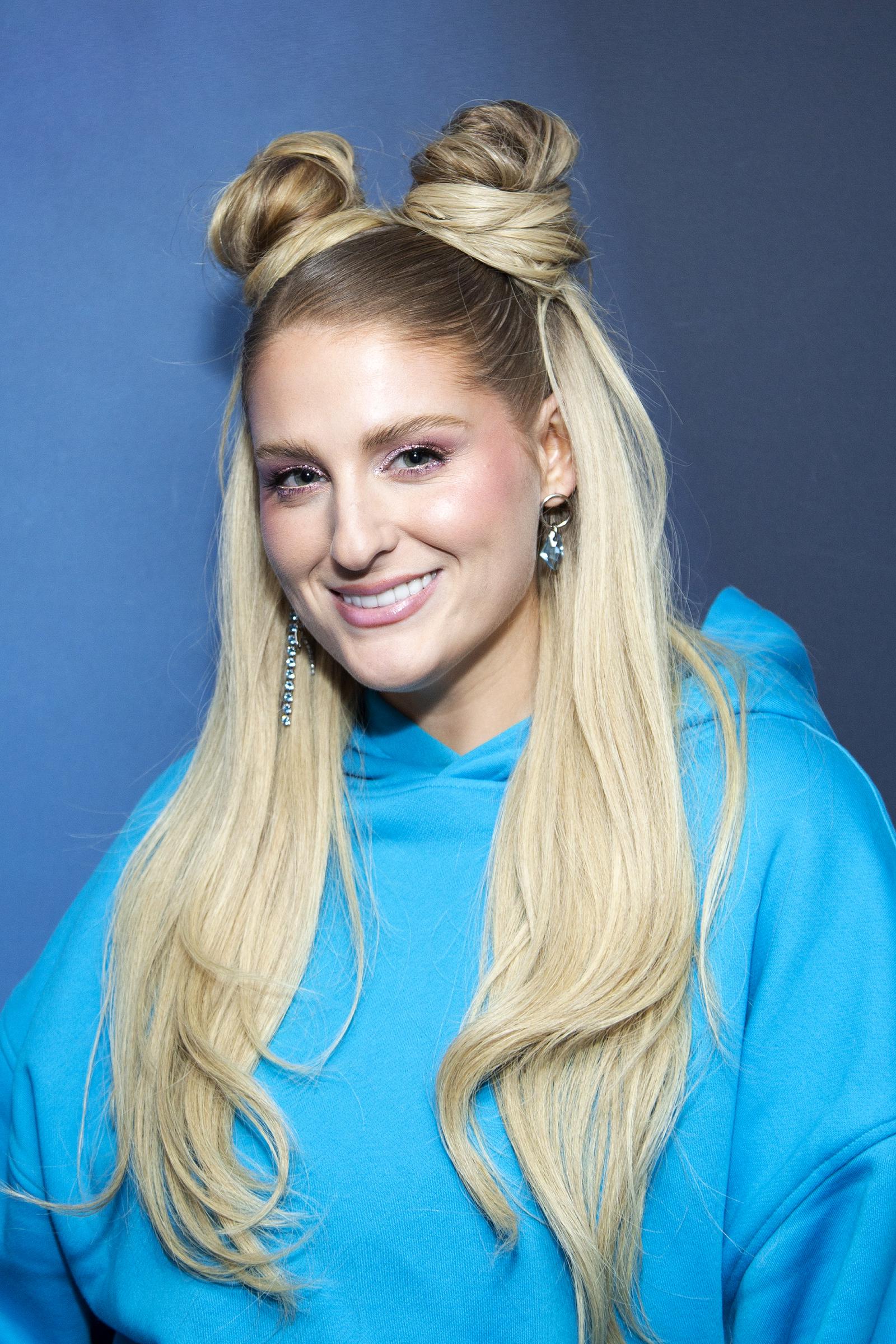 Meghan Trainor, 28, exhibited a visibly slimmer facial contour with more definition in her cheeks and jawline, and a wide, toothy smile, while visiting SiriusXM Studios on October 21, 2022, in New York City.