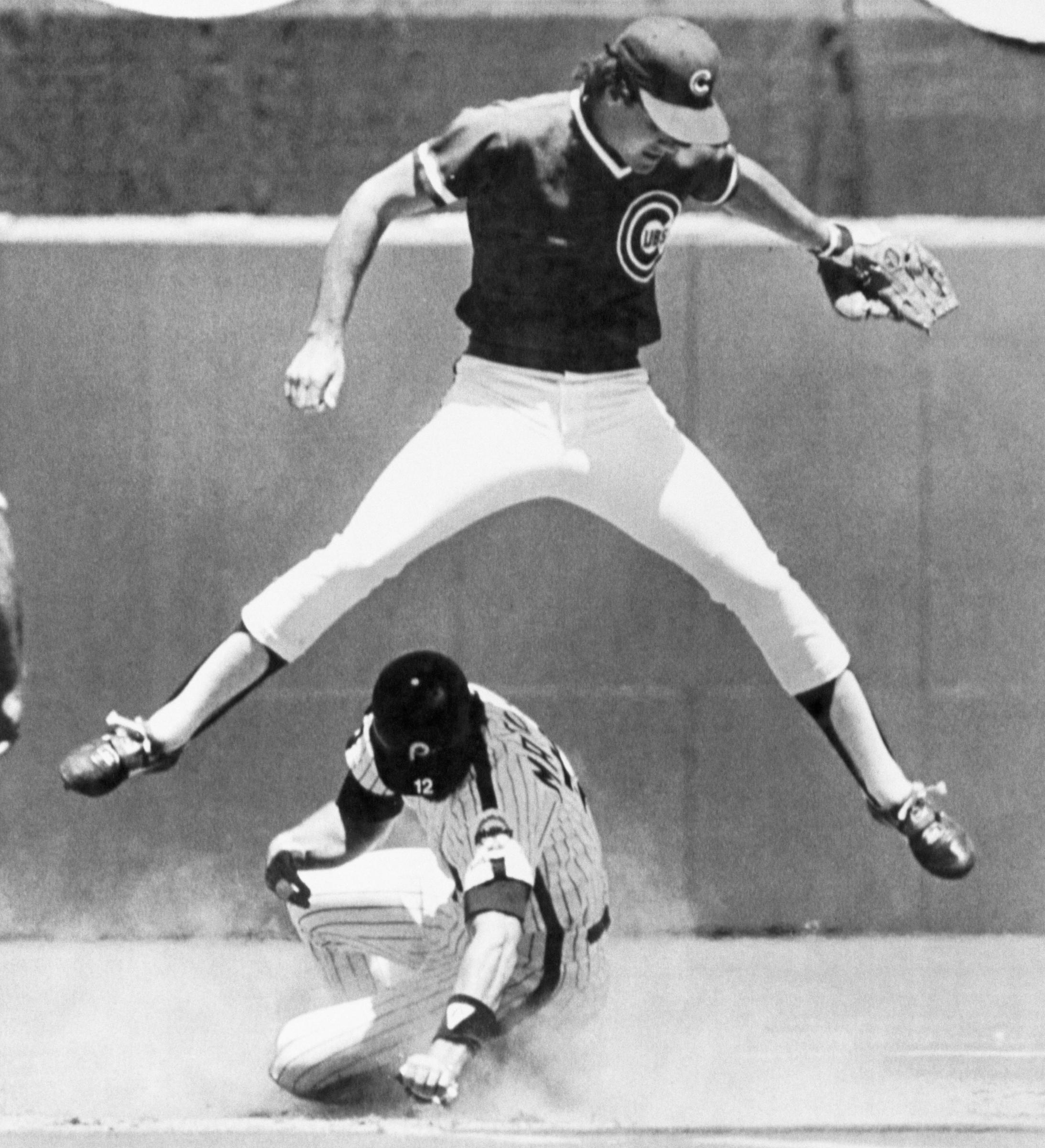 Ryne Sandberg leaps away from Philadelphia’s Ian Matoac during a stolen base play in a 9–4 win in 1984. | Source: Getty Images