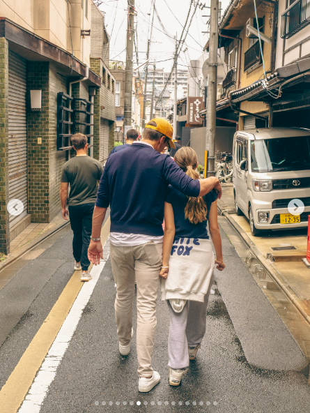 Tom Brady placing his arm around Vivian Brady as the two walk down the street. | Source: Instagram/tombrady