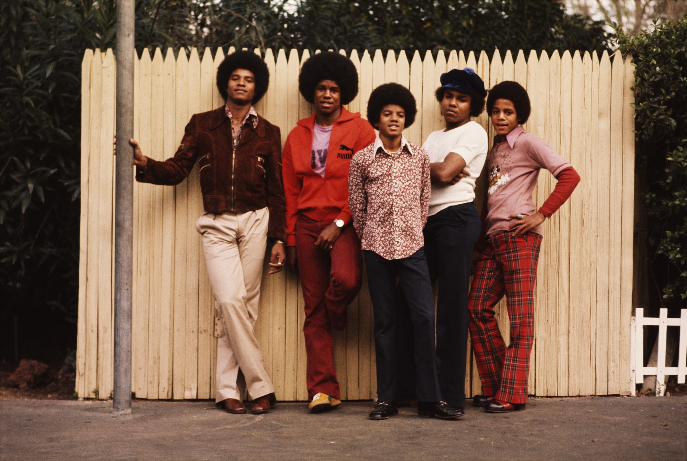 Michael Jackson stands alongside his brothers in the backyard of their home in Los Angeles. | Source: Getty Images