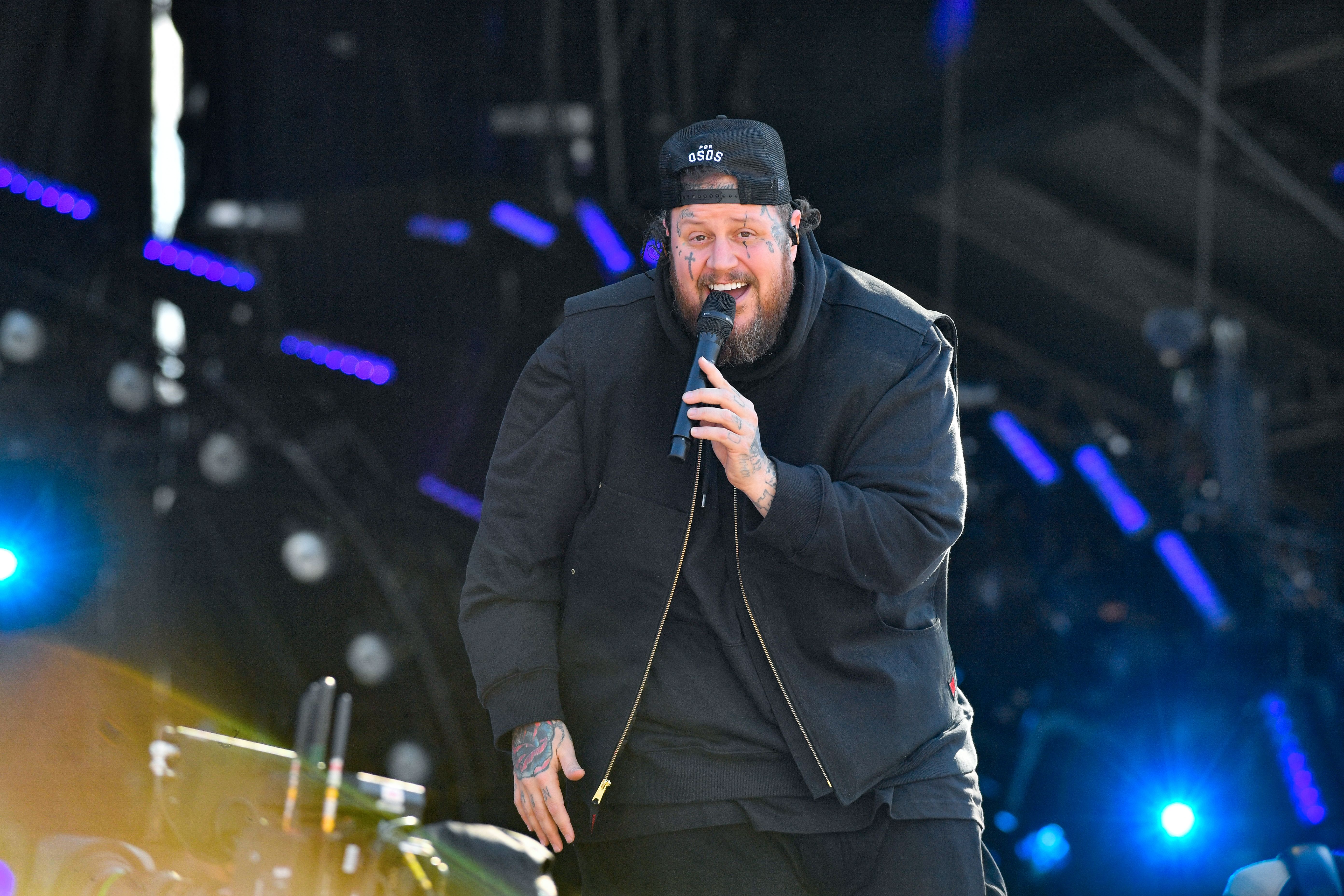 Jelly Roll on stage during the New Year's Eve Live: Nashville's Big Bash rehearsals at Bicentennial Capitol Mall State Park on December 30, 2024, in Nashville, Tennessee, wearing an all-black outfit.