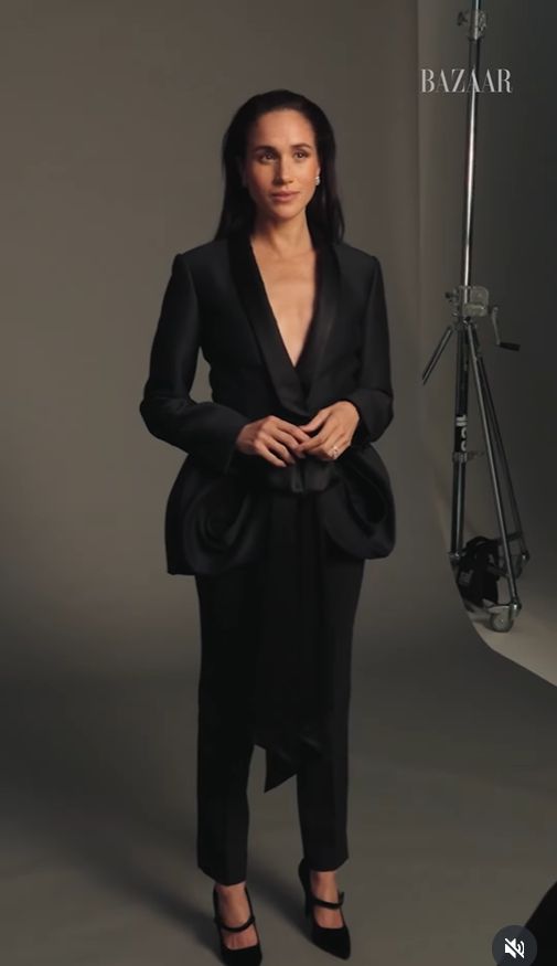 Meghan Markle in an all black ensemble, as seen from a video clip dated November 19, 2025. | Source: Instagram/harpersbazaarus