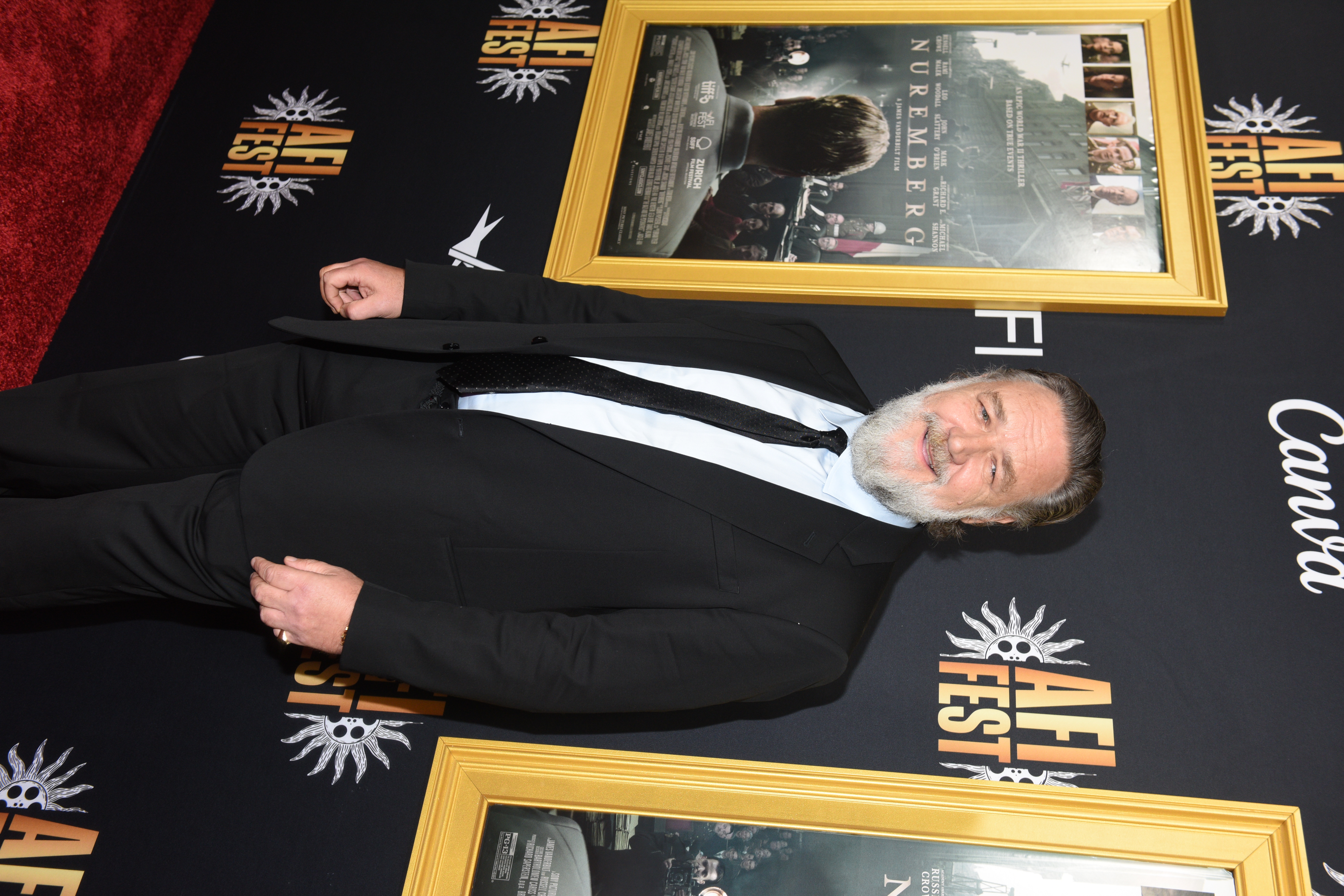 Russell Crowe walked the red carpet at the 2025 AFI Fest premiere of "Nuremberg" on October 24 in a tailored black suit and tie. Showcasing a visibly slimmer frame, he stood confidently in front of the film’s poster, drawing attention for both his performance and physical transformation.