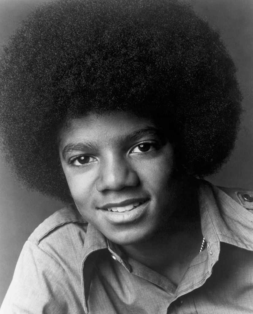 A young Michael Jackson flashes a radiant smile. | Source: Getty Images